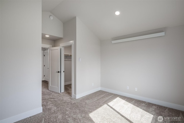 3848 Marine Way, Bellingham, WA 98225 - unfurnished bedroom with carpet flooring, vaulted ceiling, baseboards, a spacious closet, and a closet