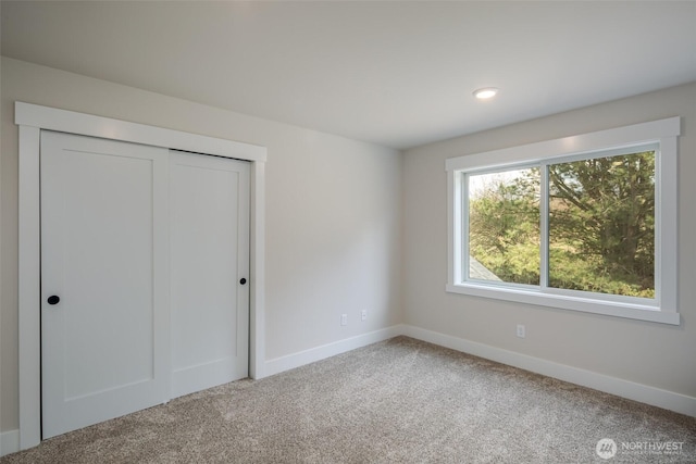 3848 Marine Way, Bellingham, WA 98225 - unfurnished bedroom featuring baseboards, carpet, a closet, and recessed lighting