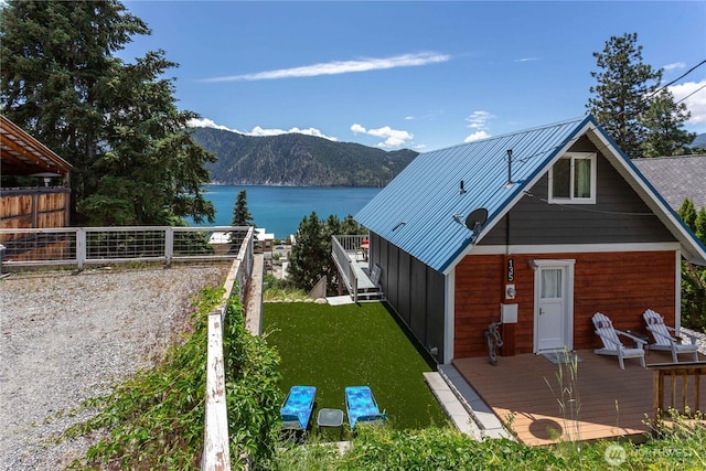 135 Furey Ave, Manson, WA 98831 - back of house featuring a deck with water view