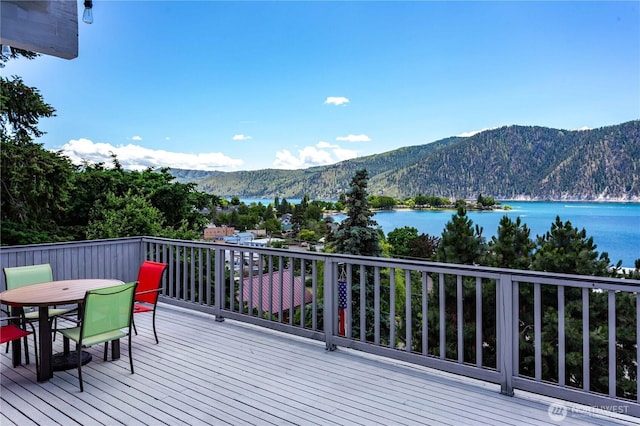 135 Furey Ave, Manson, WA 98831 - wooden deck with a water and mountain view and outdoor dining area