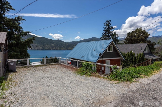 135 Furey Ave, Manson, WA 98831 - view of side of home featuring metal roof and a water and mountain view