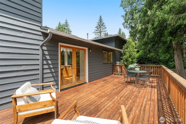 13902 106th Pl NE, Kirkland, WA 98034 - wooden terrace with outdoor dining space and french doors