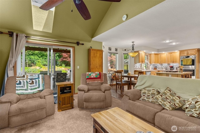 1228 Tabitha Ct NW, Olympia, WA 98502 - living area featuring light carpet, a ceiling fan, and lofted ceiling