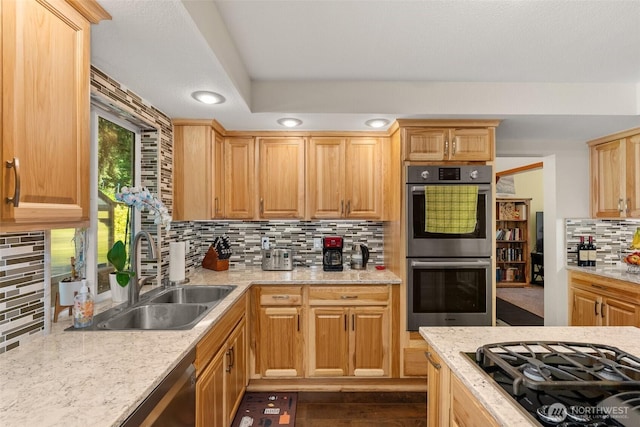 1228 Tabitha Ct NW, Olympia, WA 98502 - kitchen with appliances with stainless steel finishes, decorative backsplash, a sink, light stone counters, and recessed lighting
