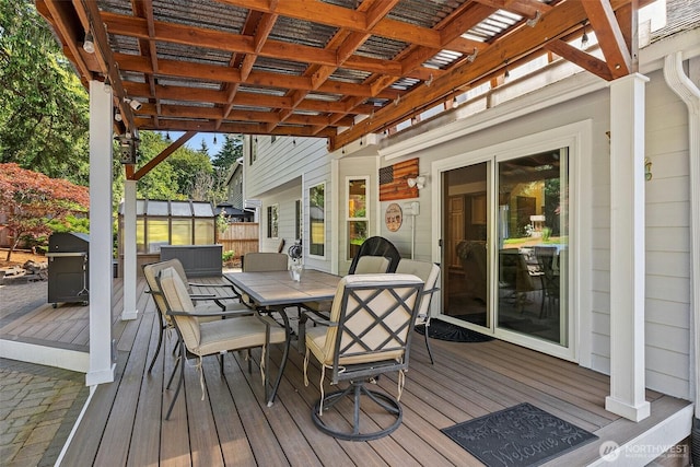 1228 Tabitha Ct NW, Olympia, WA 98502 - wooden deck with outdoor dining area and a pergola