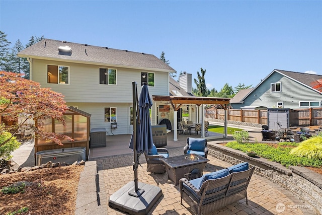 1228 Tabitha Ct NW, Olympia, WA 98502 - rear view of property with a patio, an outdoor living space with a fire pit, outdoor dining area, and a deck