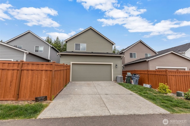 15834 205th Ave E, Bonney Lake, WA 98391 - view of front facade featuring central AC, driveway, and an attached garage
