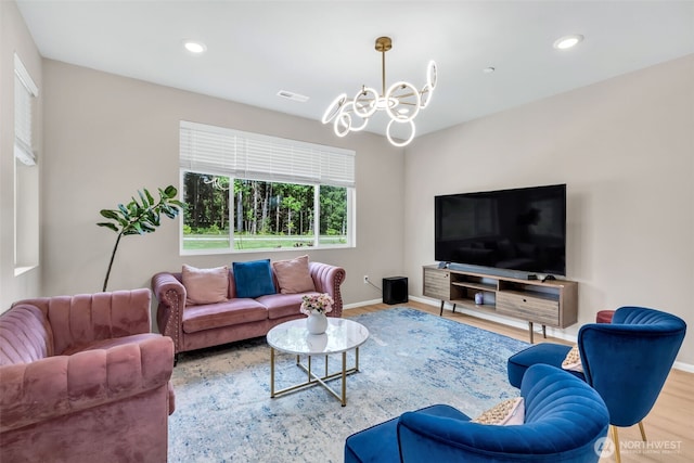15834 205th Ave E, Bonney Lake, WA 98391 - living room with a chandelier, wood finished floors, baseboards, and recessed lighting