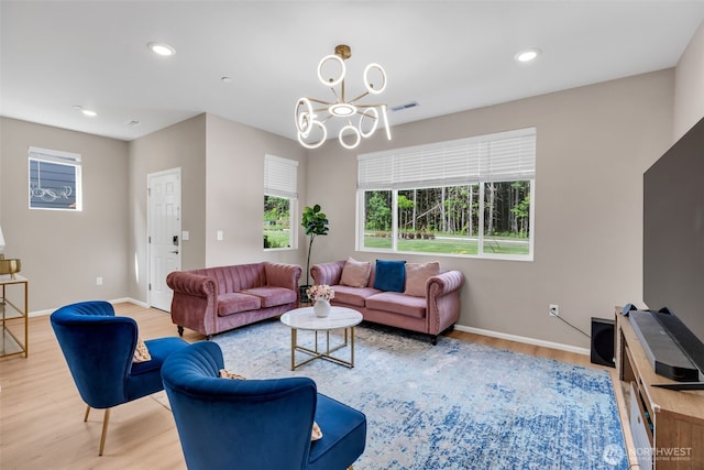 15834 205th Ave E, Bonney Lake, WA 98391 - living room with light wood-style floors, a chandelier, baseboards, and recessed lighting