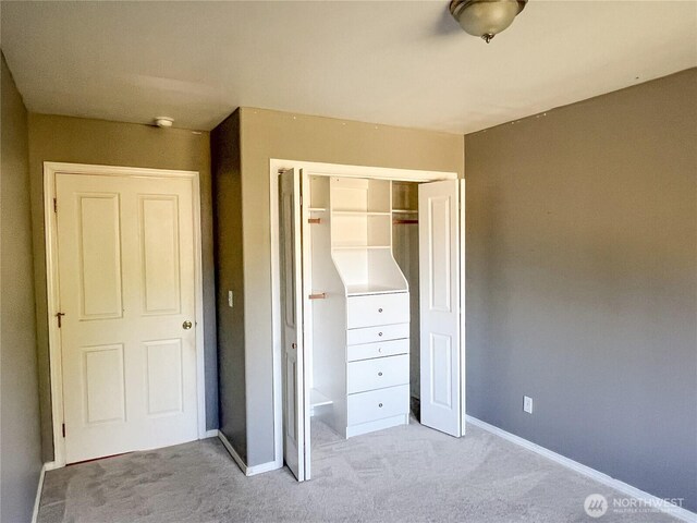 1304 Rosecrans St, Port Townsend, WA 98368 - unfurnished bedroom with light colored carpet, a closet, and baseboards