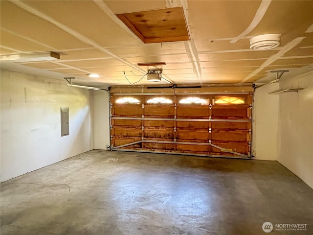 1304 Rosecrans St, Port Townsend, WA 98368 - garage featuring electric panel and a garage door opener
