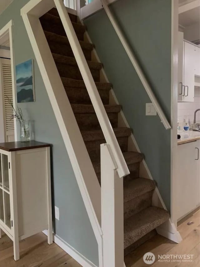 4440 Sucia Dr, Ferndale, WA 98248 - stairway featuring wood finished floors and baseboards