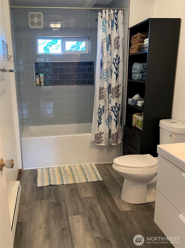 4440 Sucia Dr, Ferndale, WA 98248 - bathroom with toilet, vanity, shower / bath combo, a baseboard radiator, and wood finished floors
