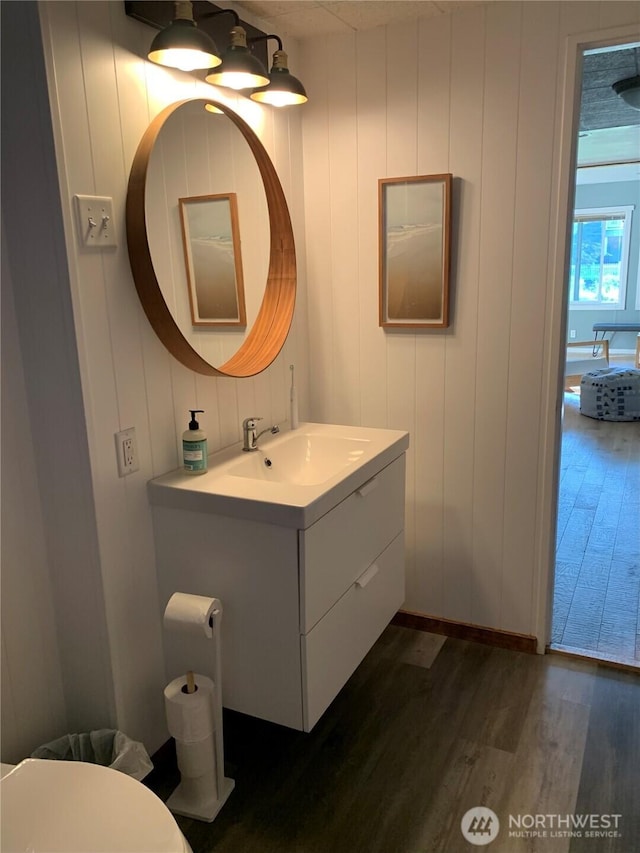4440 Sucia Dr, Ferndale, WA 98248 - half bathroom featuring wood finished floors, vanity, and toilet