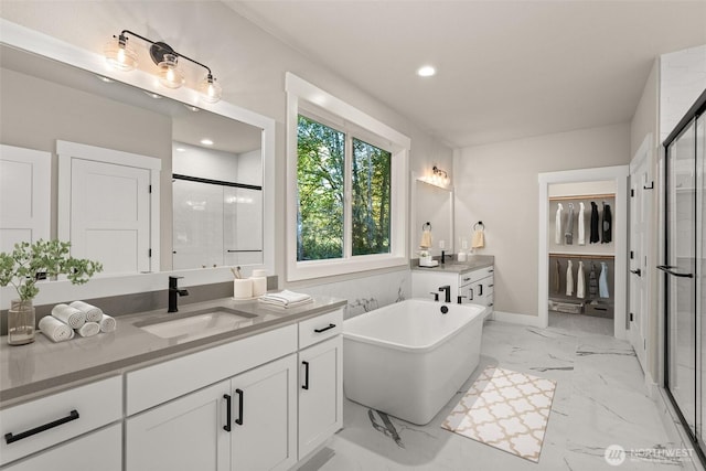 2446 64th Ave NW, Olympia, WA 98502 - bathroom with a stall shower, vanity, a soaking tub, marble finish floors, and recessed lighting
