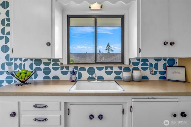 4619 SW Genesee St, Seattle, WA 98116 - kitchen featuring a sink and white cabinets