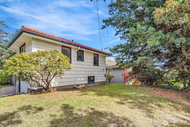 4619 SW Genesee St, Seattle, WA 98116 - view of side of home with a lawn