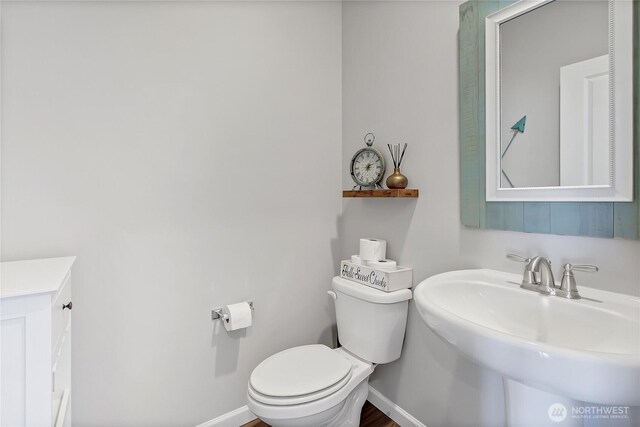 924 Livernash St, Buckley, WA 98321 - bathroom featuring toilet, a sink, and baseboards
