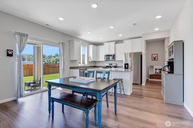 924 Livernash St, Buckley, WA 98321 - dining room featuring recessed lighting, light wood-type flooring, and baseboards