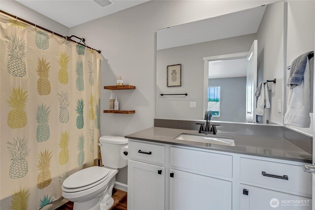 924 Livernash St, Buckley, WA 98321 - full bathroom with toilet, vanity, and a shower with shower curtain