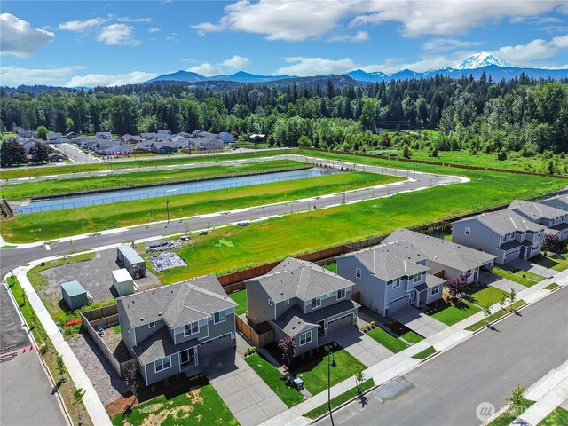 924 Livernash St, Buckley, WA 98321 - aerial view of residential area with a water and mountain view and a heavily wooded area
