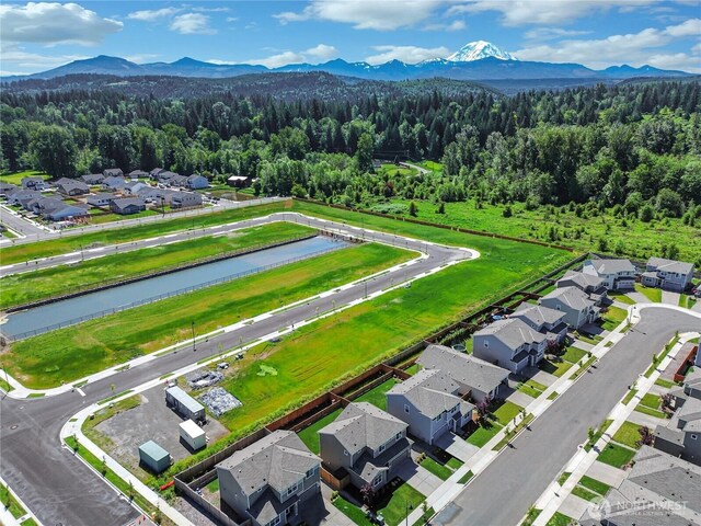 924 Livernash St, Buckley, WA 98321 - aerial view of residential area with a heavily wooded area and a water and mountain view