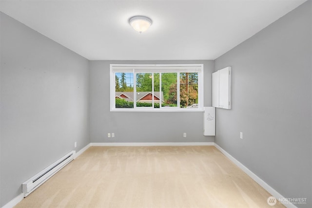 18312 73rd Ave W, Edmonds, WA 98026 - unfurnished room with a baseboard heating unit, light colored carpet, and baseboards