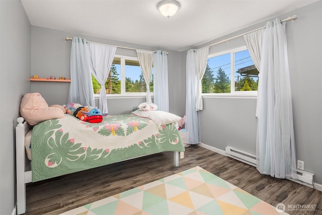 18312 73rd Ave W, Edmonds, WA 98026 - bedroom with a baseboard radiator, wood finished floors, and baseboards