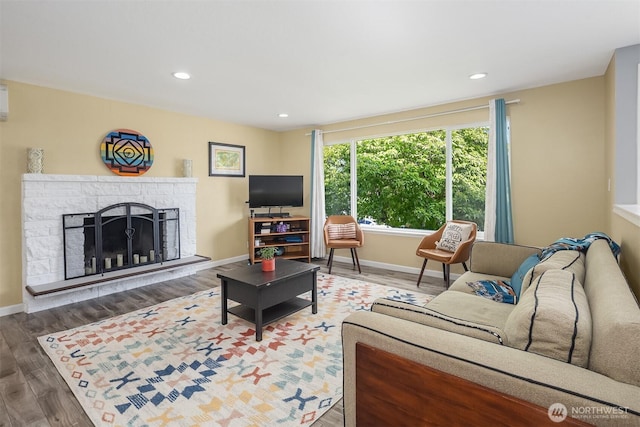 18312 73rd Ave W, Edmonds, WA 98026 - living area with plenty of natural light, wood finished floors, a fireplace with raised hearth, recessed lighting, and baseboards