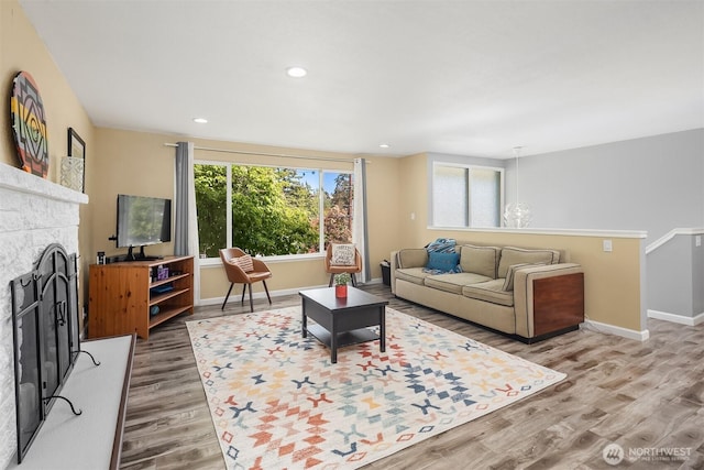 18312 73rd Ave W, Edmonds, WA 98026 - living room with light wood-style flooring, a fireplace with raised hearth, baseboards, and recessed lighting