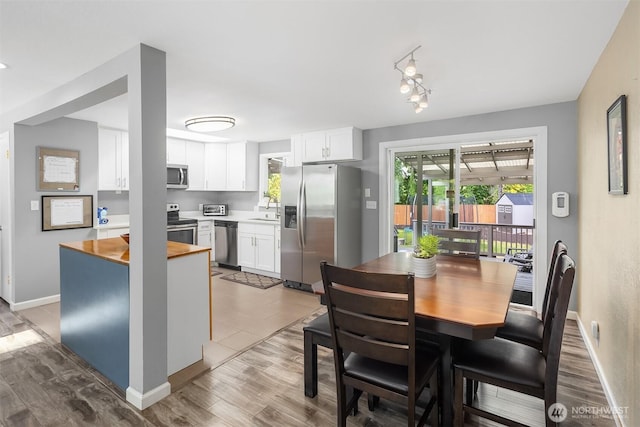 18312 73rd Ave W, Edmonds, WA 98026 - dining space featuring wood finished floors and baseboards