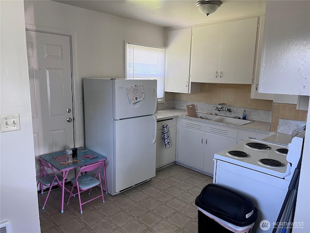 211 Cypress St, Longview, WA 98632 - kitchen featuring white appliances, a sink, light flooring, light countertops, and white cabinets