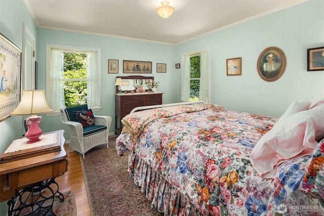 6045 Seward Park Ave S, Seattle, WA 98118 - bedroom featuring multiple windows, wood finished floors, and crown molding