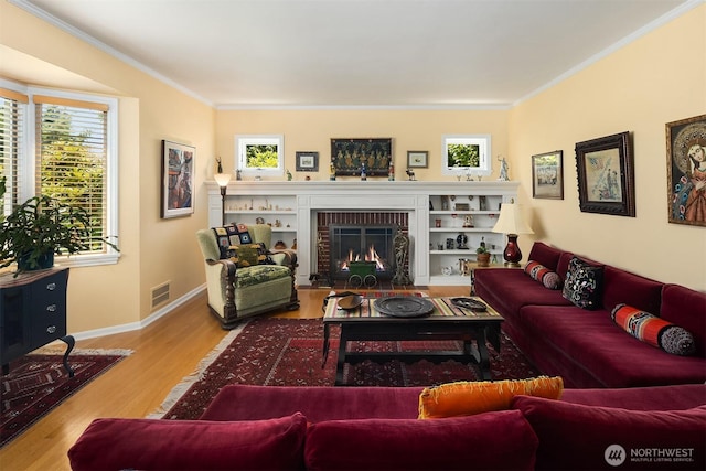 6045 Seward Park Ave S, Seattle, WA 98118 - living area featuring ornamental molding, wood finished floors, plenty of natural light, and a fireplace