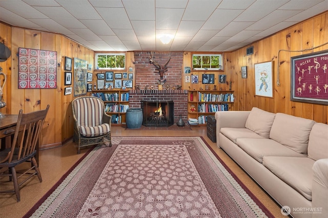 6045 Seward Park Ave S, Seattle, WA 98118 - living area featuring healthy amount of natural light, wood walls, and a brick fireplace
