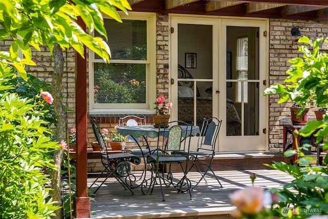 6045 Seward Park Ave S, Seattle, WA 98118 - view of patio with french doors, a deck, and outdoor dining area