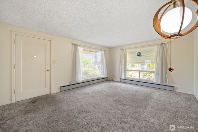 8608 16th Ave SW, Seattle, WA 98106 - carpeted empty room featuring a baseboard radiator and a textured ceiling