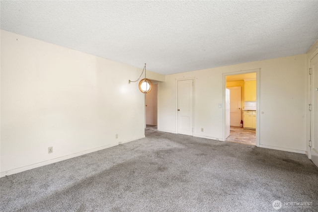 8608 16th Ave SW, Seattle, WA 98106 - unfurnished room with carpet flooring and a textured ceiling