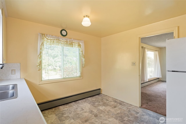 8608 16th Ave SW, Seattle, WA 98106 - unfurnished dining area with a baseboard radiator