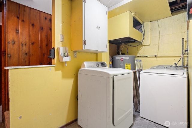 8608 16th Ave SW, Seattle, WA 98106 - laundry room with washer and dryer, electric water heater, and cabinet space