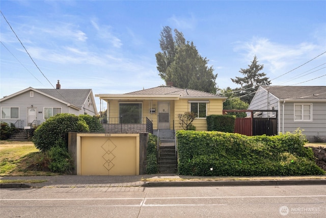 8608 16th Ave SW, Seattle, WA 98106 - bungalow with a garage, driveway, and stairs