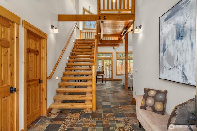 16375 NE 44th Ct, Redmond, WA 98052 - stairs featuring a high ceiling, stone finish floors, plenty of natural light, and baseboards