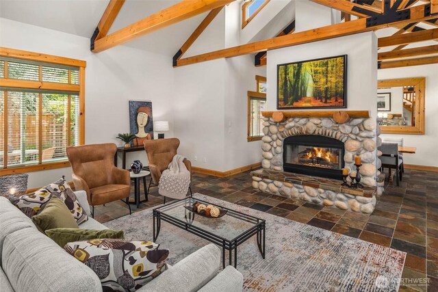 16375 NE 44th Ct, Redmond, WA 98052 - living room featuring stone tile flooring, baseboards, high vaulted ceiling, beamed ceiling, and a fireplace