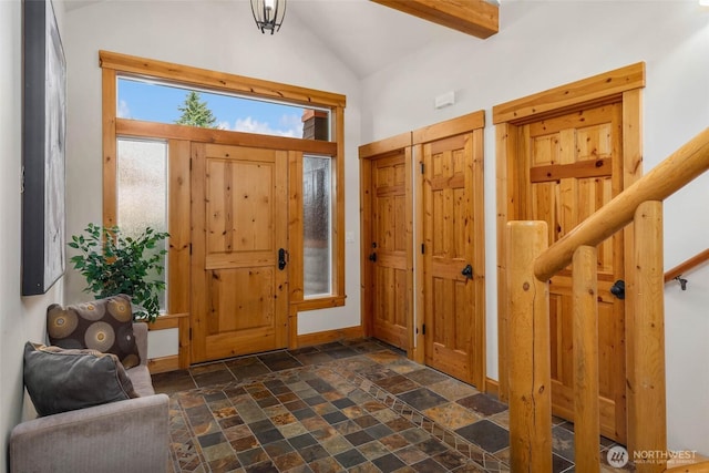 16375 NE 44th Ct, Redmond, WA 98052 - foyer entrance with stone tile floors, lofted ceiling, and baseboards