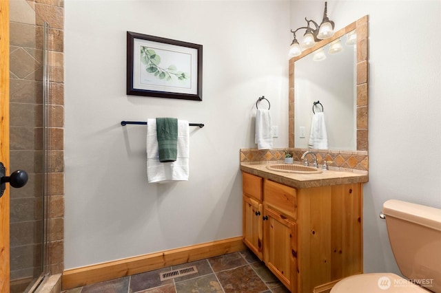 16375 NE 44th Ct, Redmond, WA 98052 - full bath with toilet, vanity, baseboards, tiled shower, and tasteful backsplash