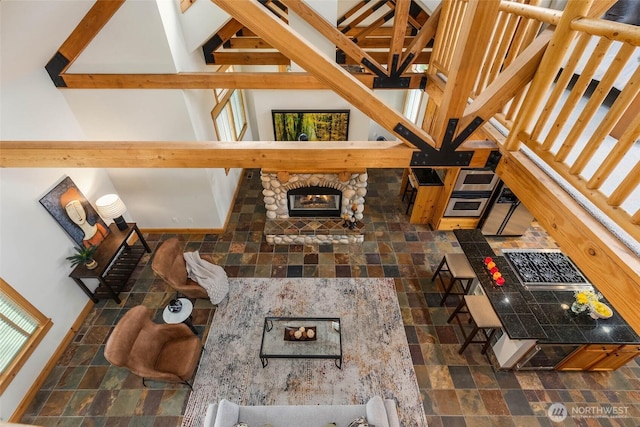 16375 NE 44th Ct, Redmond, WA 98052 - living area featuring dark stone finish flooring and a stone fireplace