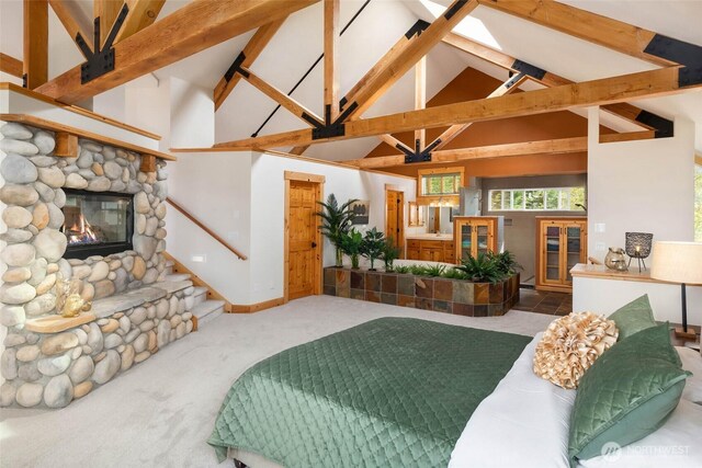 16375 NE 44th Ct, Redmond, WA 98052 - carpeted bedroom with high vaulted ceiling, a stone fireplace, and beam ceiling