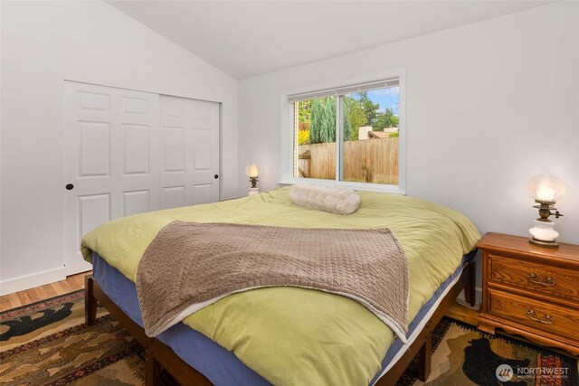 16375 NE 44th Ct, Redmond, WA 98052 - bedroom featuring vaulted ceiling, wood finished floors, and a closet