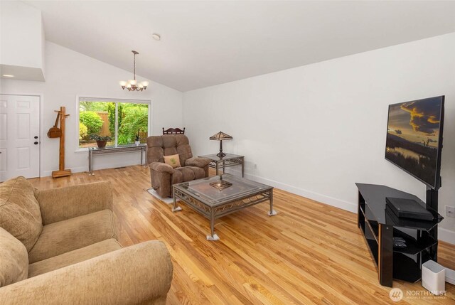 16375 NE 44th Ct, Redmond, WA 98052 - living room with light wood-type flooring, a chandelier, baseboards, and high vaulted ceiling