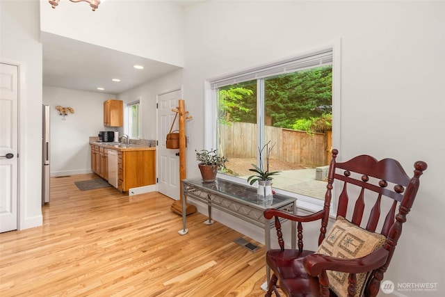 16375 NE 44th Ct, Redmond, WA 98052 - dining room featuring light wood-style floors, baseboards, and recessed lighting